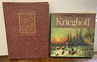 Two vintage hardcover books side by side: Audubon 'The Birds of America' (brown) and Krieghoff (with illustrated dust jacket).
