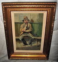 Frontal view of the framed oil painting showing the seated man with pipe and signature in lower left corner.