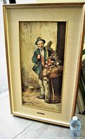 Full view of framed oil painting showing aged man and vegetable table.