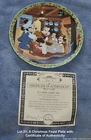 Photo of the decorative plate showing Mickey's Christmas Carol scene and accompanying certificate of authenticity.