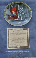 Plate featuring Mickey Mouse and other characters in a Christmas Carol scene with holly border, alongside Certificate of Authenticity.