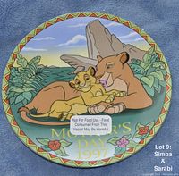 Front view of the decorative plate showing Simba and Sarabi illustration, text 'Mother's Day 1997', and safety warning label.