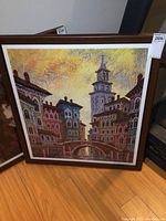 Full view of the framed seriolithograph showing the entire Venice canal scene with buildings, bridge, tower, and yellow sky.