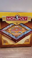 Front of the Monopoly Premier 70th Anniversary Edition box showing game board and design.