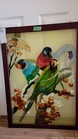 Full view of framed glass panel with painted birds on tree branch showing size note 27x19 and dark wood frame.