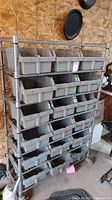 Full view of metal shelving unit with 6 tiers and 18 bins