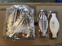 Ten individually packaged white 3M N95 masks arranged showing front and back views with plastic packaging.