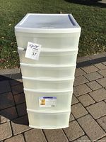 Front view of the 6-drawer plastic organizer showing all drawers and the top surface.