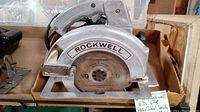 Front view of the Rockwell circular saw showing the blade marked 7 1/4 x 9 Teeth and the main body with Rockwell branding.