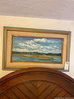 Full frontal view of the framed marsh landscape painting