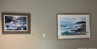 Overview of both framed artworks mounted on wall