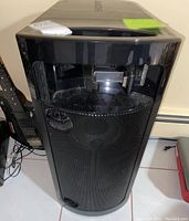 Front view of the Sony speaker showing large speaker grille and iPod dock.