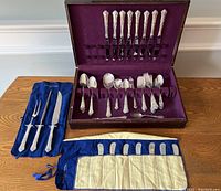 Full view of flatware, butter spreaders, carving set and storage box