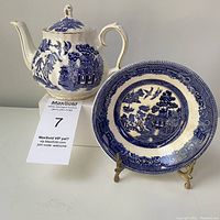 Blue Willow pattern ceramic single serve teapot by Sadler and matching small bowl by Johnson Brothers displayed together