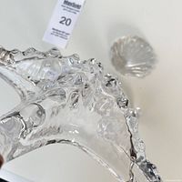 Close-up of textured clear glass starfish showing detailed surface and robustness.