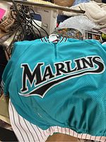 Teal Florida Marlins mesh button-front jersey laid flat