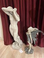 Front view of both sculptures side by side showing relative heights and overall appearance.