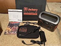 Power station, solar panel case, AC adapter, DC charging cable, manuals and promotional cards