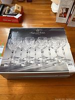 Box of Imperial Estate crystal glasses showing the top view with image of 8 glasses and branding