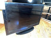 Front view of Samsung 32 inch television showing screen and base.