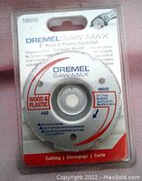 Front view of Dremel Saw-Max 3 inch wood and plastic flush cut carbide wheel in original packaging showing product details and model number SM600.