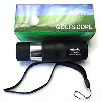 Nilland monocular golf scope shown with original branded box with green golf field image and product name 'GOLFSCOPE'