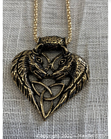 Gold tone necklace pendant showing two wolves facing each other with wings forming a heart shape around a Celtic Trinity Knot design.