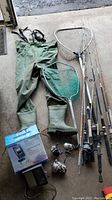 Overview of all fishing gear including rods, reels, nets, waders, and fish finder