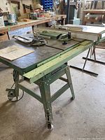 General International table saw front and side view showing overall work surface and miter gauge.