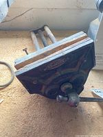 Close-up photo of the front side of the Craftsman wood bench vise showing the wooden jaws and metal frame with handle.