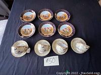 Six antique decorative plates and six cups with saucers arranged on black background