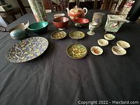 Full lot of Asian decorative ceramics on black tablecloth
