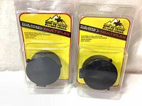 Two new Butler Creek Flip-Open Scope Covers packaged in blister packs, front view showing the covers and branding.