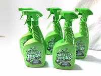 Five green Primos Control Freak spray bottles arranged together.