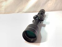 Front view of Excalibur Twilight DLX Multi Plex scope showing the large objective lens with multi-coated glass.