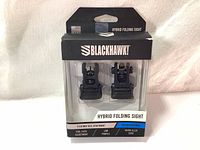 Photo of the Blackhawk Hybrid Folding Sight set in retail packaging, showing front and rear sights in clear plastic.