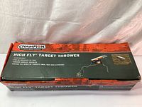 The original Champion High Fly Target Thrower box with product branding and features listed.