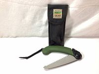 Photo showing the saw unfolded with blade and carrying case displayed.