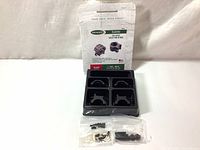 Overall view of Weaver Classic Six-Hole Skeleton Rings with original packaging and included screws in plastic tray.