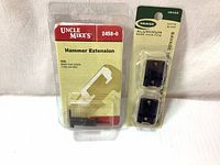 Packaging of Uncle Mike's hammer extension and Weaver aluminum base pair fit for Savage.