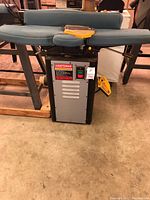 Front view of Craftsman Professional jointer-planer with foam table covers