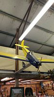 Front starboard profile of airplane suspended from ceiling