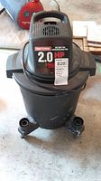 Front view of Craftsman shop vacuum showing brand, horsepower and capacity labels.