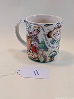 Side view of the mug showing the Queen of Hearts and the beginning of the story text around the mug