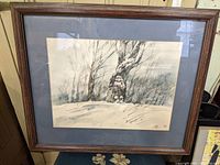 Frontal view of framed painting depicting child in snowy winter woods with visible signature and date 1987.
