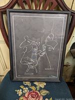 Front view of framed lithograph depicting minimalist musicians drawing by George Luttrell.