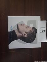 Photo showing the box of OnePlus Buds Z2 true wireless earbuds with a side profile image of a male wearing the earbuds