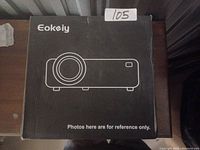 Photo of the Eokeiy projector box showing the brand and product line drawing on the box.