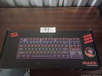Photo of Black box showing Redragon Kumara K552 RGB mechanical keyboard packaging with branding and model name visible.