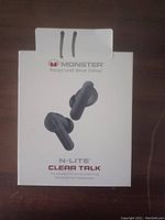 White retail box showing image and branding of Monster N-Lite Clear Talk wireless in-ear headphones.